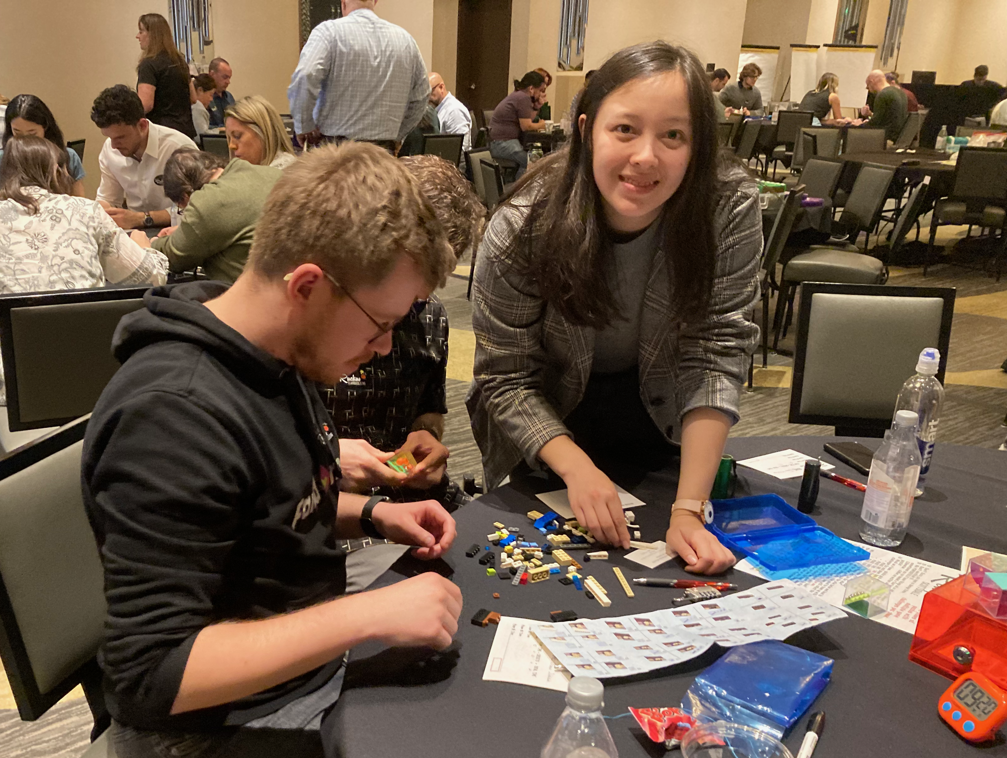 woman smiling doing puzzle